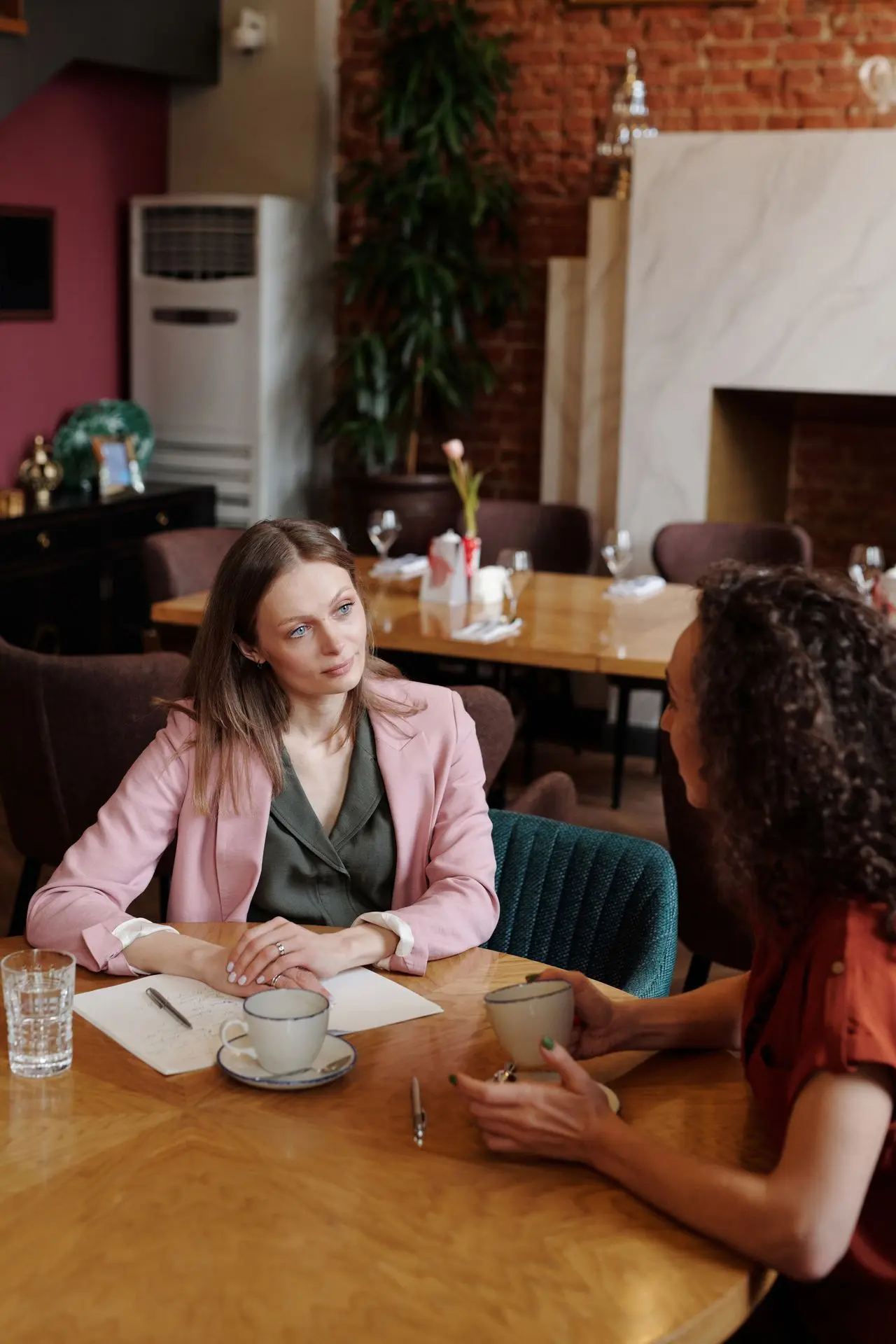 Women survivors talking over coffee