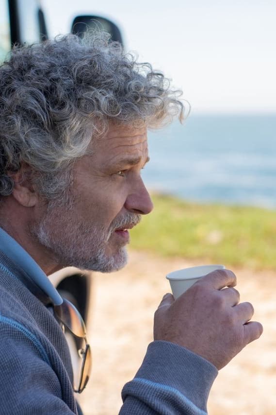 Supporter of survivor reclaiming personal space near beach
