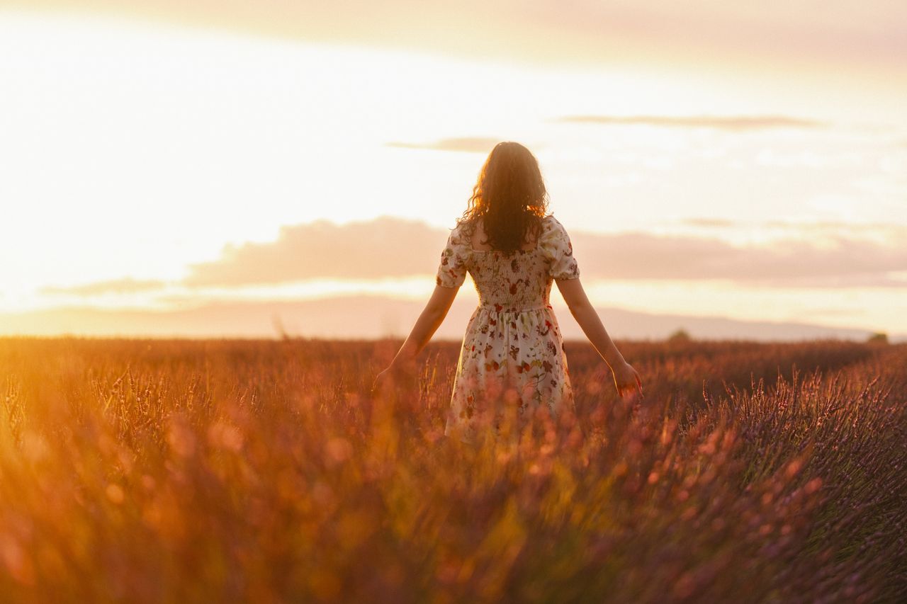 Woman in an open field no phone or social media