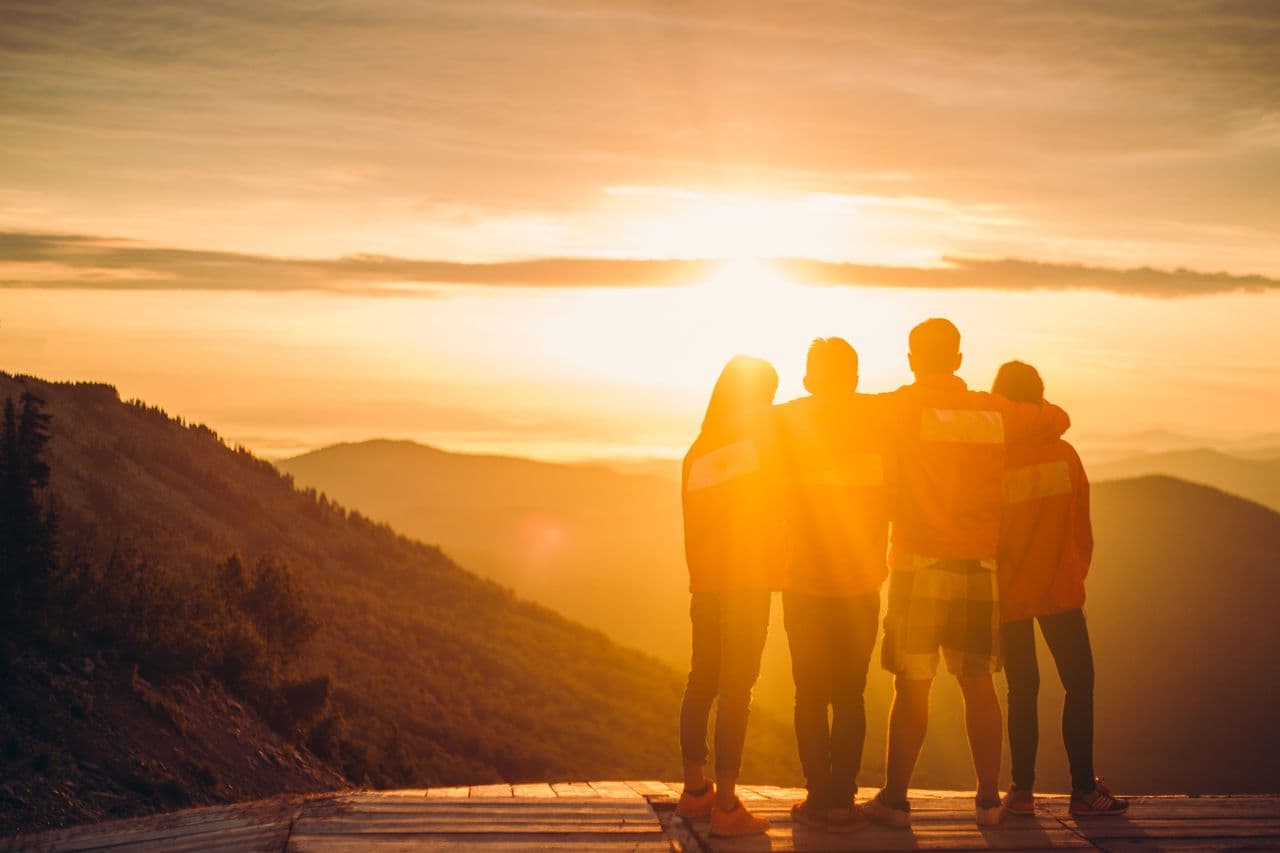 Family watching a new dawn and a new day
