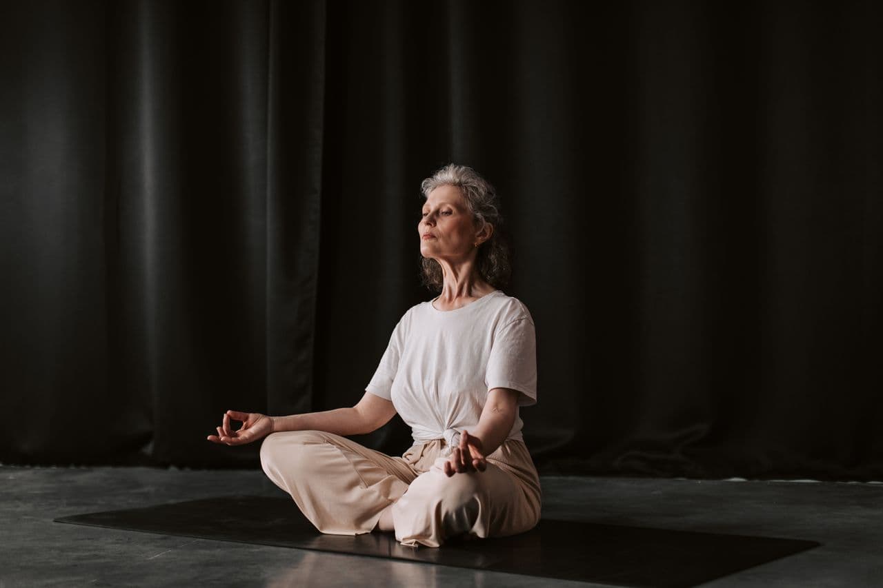 Woman survivor deep rhythmic breathing avoiding worry